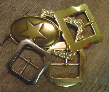 Old West Belt Buckles Badges and Western Jewelry